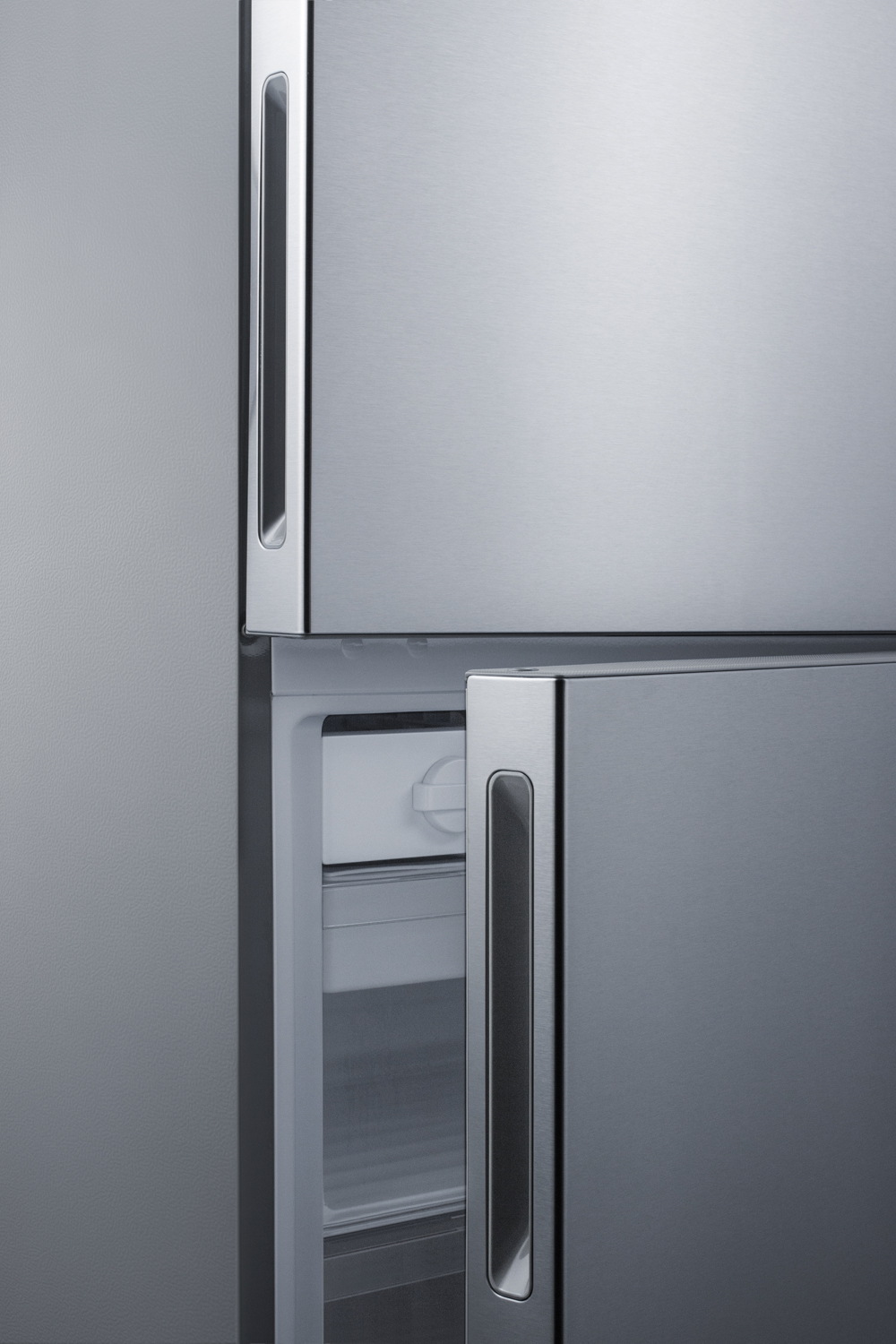 Frost-free ENERGY STAR certified bottom freezer refrigerator in stainless steel with digital controls and a counter depth fit